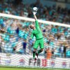 Manchester City's Joe Hart tips the ball over the bar